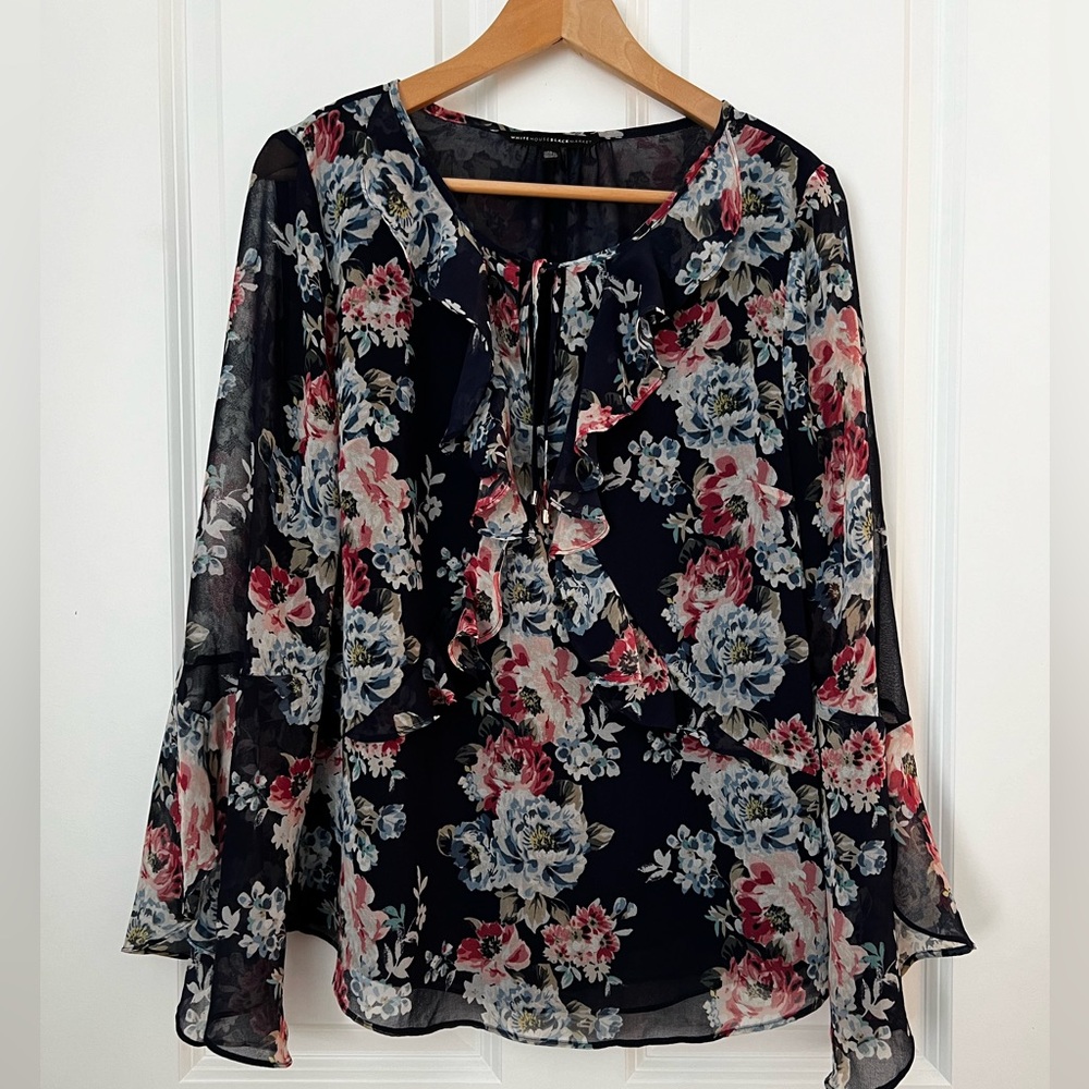 White House Black Market blue flowered blouse with sleeve and front ruffles. S12
